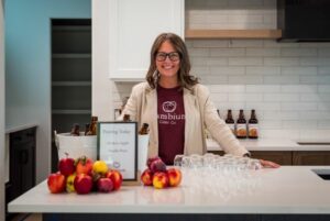 Woman from Cambium Cider at Morningview Grand Opening
